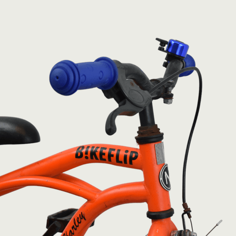 14.38 - BikeFlip, 14 inch fiets, oranje fiets, terugtraprem en handrem, geen versnellingen, kabelslot, verlichting