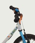 14.35 - BikeFlip 14 inch fiets, witte B-Twin kinderfiets, handremmen, geen versnellingen, kabelslot, beren kettingbeschermer.