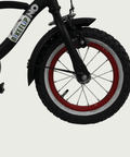 12.85 - BikeFlip, 12 inch kinderfiets, zwarte cruiser, lichtgevende rode velgen, terugtraprem, handrem, kabelslot, stoer